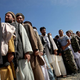 Afghan citizens line up to vote in, sabotage, or just observe August's presidential election.